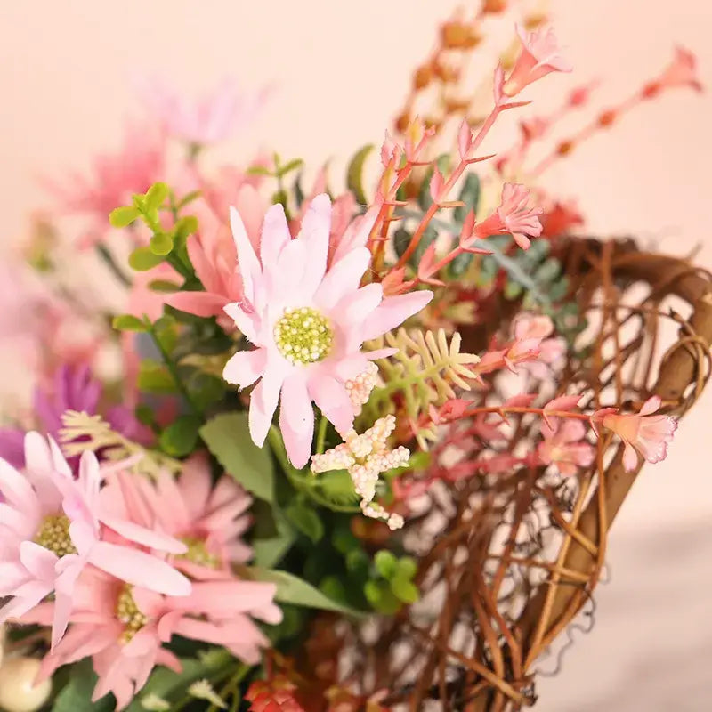 Close-up detail of daisies on a vine wreath.