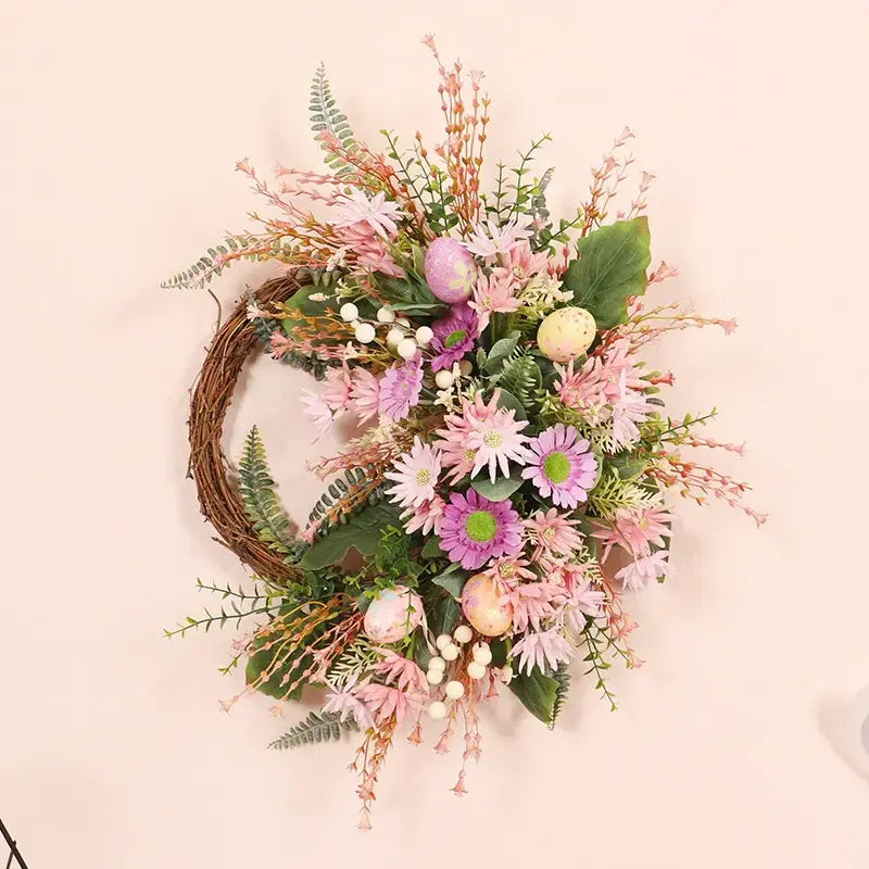 Colorful festive half-sided artificial wreath with decorative eggs and a variety of faux flowers